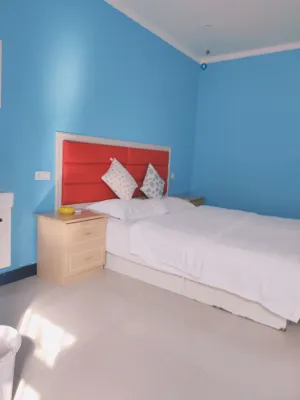 Xinyang Wanjia Hotel - 2 Yıldız