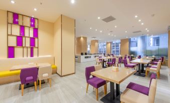 The restaurant has a dining room in the center with tables and chairs specifically designed for business luncheons at Lavande Hotel