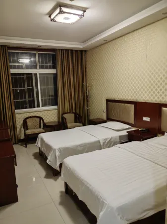 Jindiyuan Hotel (Zhenping Shifosi) Отели в г. Чженьпин