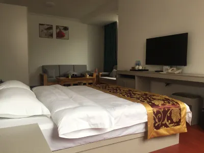 Mengla Yishang Business Hotel Отели рядом с достопримечательностью «Ночный рынок Singling Xinhua Nanlahe»