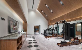 The gym is designed as a spacious room with integrated storage and an indoor setting at UrCove by HYATT Nanjing South Railway Station