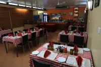Huon Gulf Hotel & Apartments - Desayuno