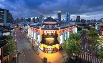 The city features buildings, street lights, and an Asian-themed restaurant at Autoongo Hotel On the Bund, Shanghai