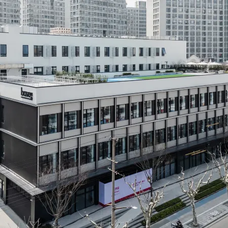baseLITE-ANBO Serviced Apartment Отели рядом с достопримечательностью «Стадион «Цзянвань»»