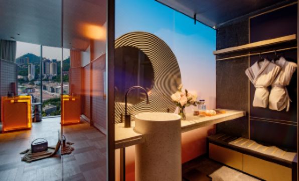 This modern house features a bathroom with large windows, providing an outside view from the living area at Grade Hotel Shenzhen sea world
