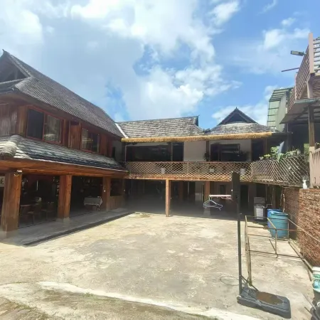 Manghong Yongbanghao · Traditional Blang Stilt‑House (Jingmai Ancient Tea Forest)