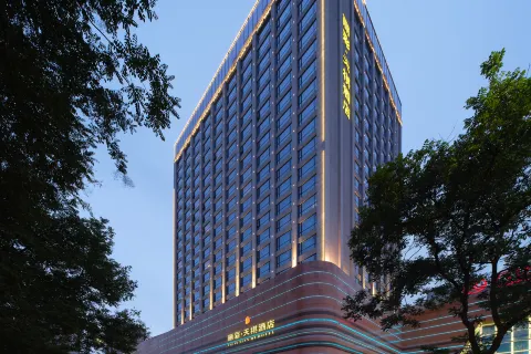 Li Cai Tian Qi Hotel