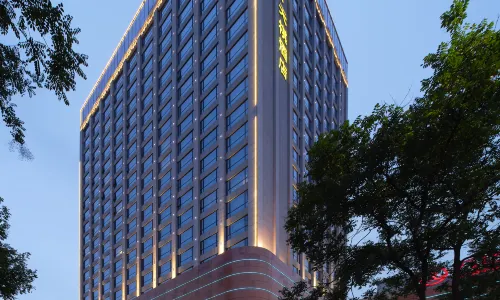 Li Cai Tian Qi Hotel