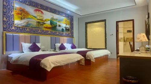 Q+ Nanxiong Xinhewan Business Hotel
