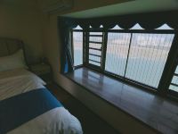 儋州候鸟管家公寓 - 海花岛尊享四房四卫观海望远海景公寓