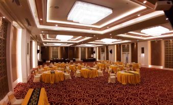 a large conference room with many tables and chairs , all set up for a meeting or event at Bromo Park Hotel Probolinggo