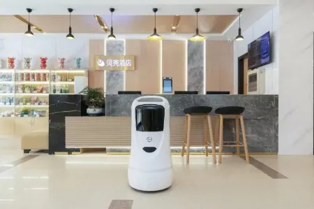 Shell Hotel (Xuzhou Xinyi Nanjing Road Railway Station) Отели в г. Синьи