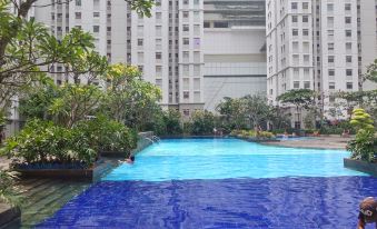 2Br Cozy at Green Bay Pluit Apartment Baywalk by Travelio