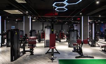 Guests have access to a gym equipped with rows of weight machines and an indoor exercise facility at Novotel Shanghai Hongqiao exhibition center hotel