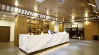 Quanpan Yaju Hotel (Qiannan Zhisheng Tangquan Building 5)