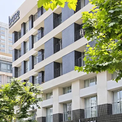 base WENDING Serviced Apartment Отели рядом с достопримечательностью «Шанхайский стадион»