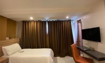 Capital O 820 Guijo Suites Makati