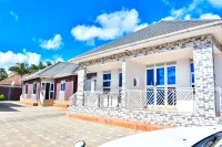 The Biira Residence Hotels near Kyewaga Central Forest Reserve