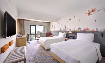 The bedroom features double beds, large windows, and a balcony with a view of the pool area at Hilton Garden Inn Guangzhou Tianhe