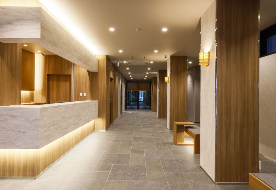 오사카 플럼 호텔의 객실 침대 모습