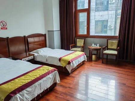 Shidian Yixu Business Hotel Отели рядом с достопримечательностью «Qingniu Baima Square»