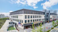 Home Inn UP Huayi Zhilv Hotel (Wenzhou Leqing Puqi Life Square Branch) Отели рядом с достопримечательностью «Станция Вонг-Шио Юань»
