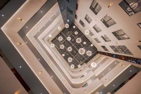 Qixinlong Sightseeing Hotel Отели рядом с достопримечательностью «Zhusheng Bridge»