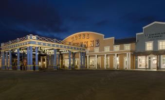 "a large hotel with a sign that reads "" hotel san diego "" prominently displayed on the front of the building" at Disney Hotel Cheyenne