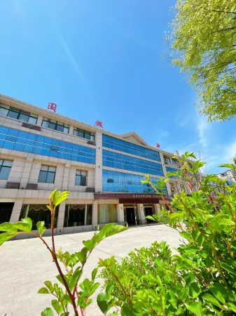 Guannan Guocheng Holiday Hotel Отели рядом с достопримечательностью «Er'langshen Culture Relics Park»