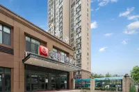 Junyi Chain Hotel (Zhengzhou Tourism Vocational College Dianli Gaozhuan) Hotel di Zhongmu