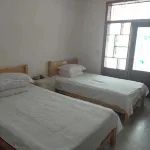 Yilong Xingfuju Hotel