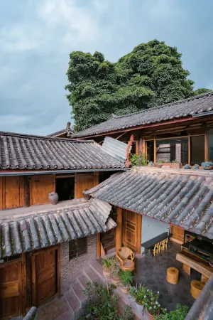 Gujing Inn Отели в г. Юньлун