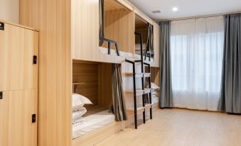 The bedroom features bunk beds and wooden ladders for sleeping at Dayin International Youth Hostel（East Nanjing Road & The Bund）