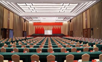 A spacious room with rows of chairs is arranged for events or conferences at NINGDE SANDU'AO FLIPORT HOTEL