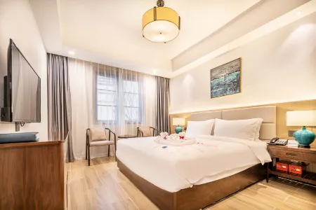 ANYIYUESHE HOTEL Отели рядом с достопримечательностью «Bailu Limestone Cave Wonder Peak»