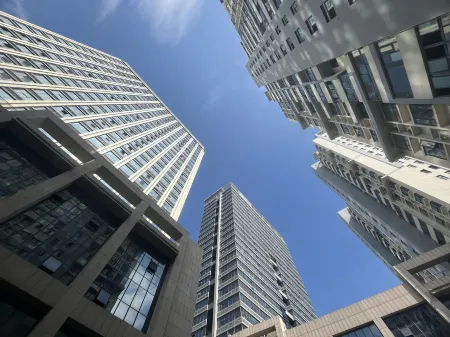 Xiaocao Homestay (Shiji Haoyuan) Отели в г. Синьи