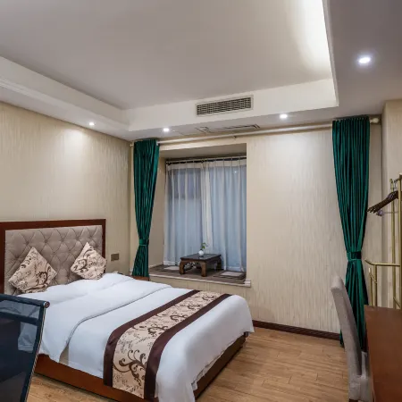 Quxian Garden Business Hotel (Qianrenli Wealth Center Branch)