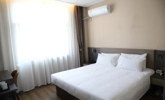 Huianda Traveler-Inn Hotel (Yichun Zhangshu East Station)