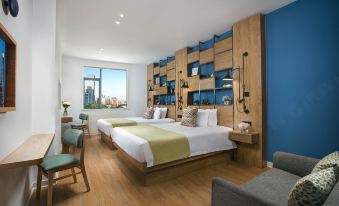 The modern-style bedroom features double beds and large windows that offer a view of the pool area at Campanile Hotel (Shanghai Jing'an)