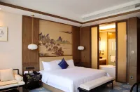 Wyndham Grand Plaza Royale Zhaotong Отели рядом с достопримечательностью «Спортивный стадион Юябаошана»
