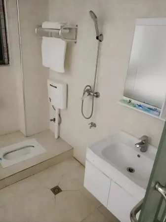 Duchang Baoqing Hotel Отели в г. Доучань