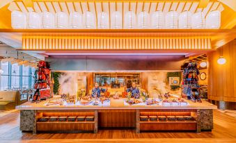 The restaurant offers a wide variety of food options displayed on the counter at Chimelong Spaceship Hotel
