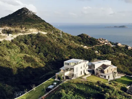 Wenling POCOaPOCO Pugu Homestay Отели рядом с достопримечательностью «Wenling Shitang Peninsula Tourist Resort»