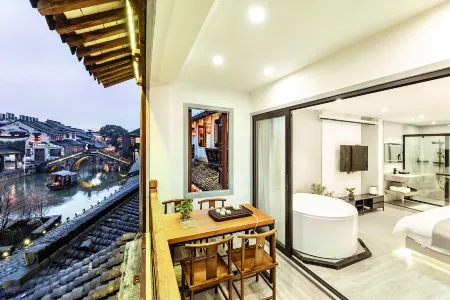 Xitang Muguang Qiyin Homestay Отели в г. Цзяшань