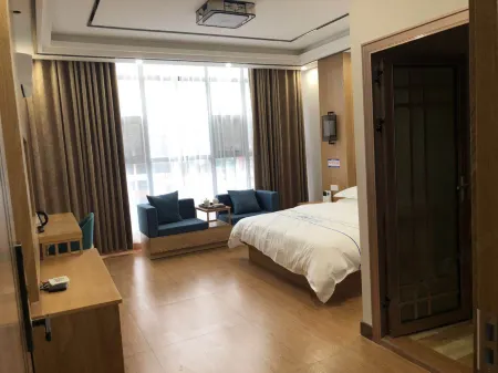 Zhenxiong Tangjia Hotel (Wudezhen Branch) Отели рядом с достопримечательностью «Tiankeng Group»