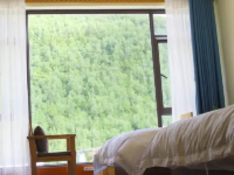 Four Sisters Mountain Knapsack International Hostel Hoteles en Xiaojin