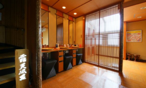 The room features large windows, tiled floors, and an enclosed shower area adjacent to it at Fuji Ginkei