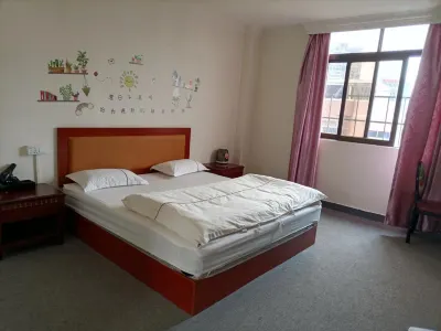 Xingxin Elevator Apartment Hotels in Xiegang Town