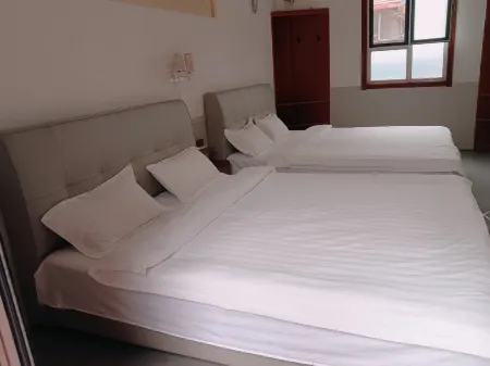 Yinan Juquan Homestay (Zhuquancun) Отели в г. Инань