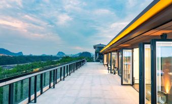 This modern home on top offers a spacious balcony with stunning views of the city and surrounding hills at WING HOTEL